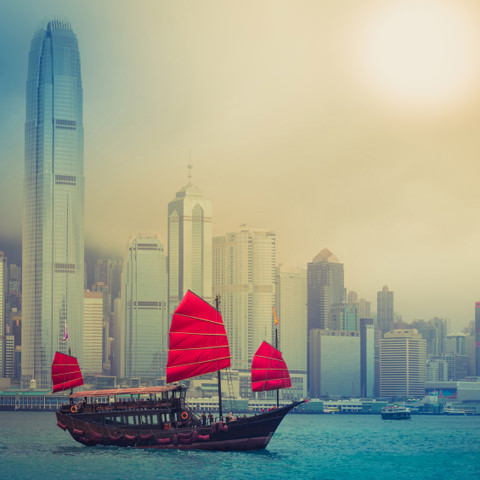 Traditional Chinese junk-boat sits in a bay: At RIVO International we connect clients with their marketplace.